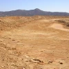 A dry, dusty desert landscape.